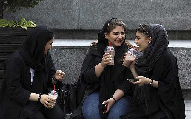 In this Tuesday, July 2, 2019 photo, youngsters spend an afternoon while siting on steps outside a shopping mall in northern Tehran, Iran (AP Photo/Vahid Salemi) In this Tuesday, July 2, 2019 photo, youngsters spend an afternoon while siting on steps outside a shopping mall in northern Tehran, Iran (AP Photo/Vahid Salemi)