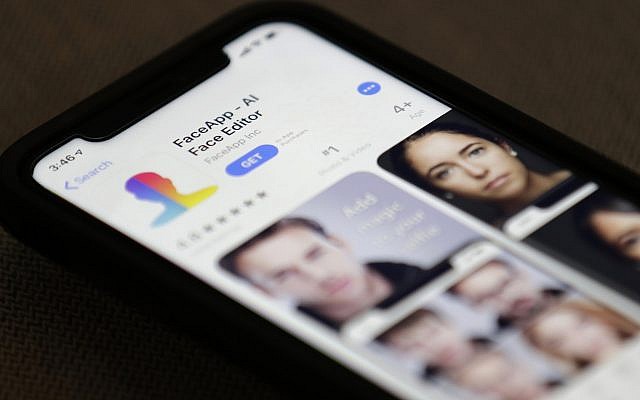 FaceApp is displayed on an iPhone, July 17, 2019, in New York. (AP Photo/Jenny Kane)