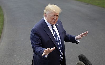 US President Donald Trump speaks to members of the media before boarding Marine One helicopter on the South Lawn of the White House in Washington, for the short flight to nearby Andrews Air Force Base, Maryland, July 19, 2019. (AP Photo/Pablo Martinez Monsivais)