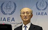 In this November 22, 2018, file photo, International Atomic Energy Agency (IAEA) Director General Yukiya Amano of Japan addresses the media during a news conference after a meeting of the IAEA board of governors at the International Center in Vienna, Austria. (AP Photo/Ronald Zak)
