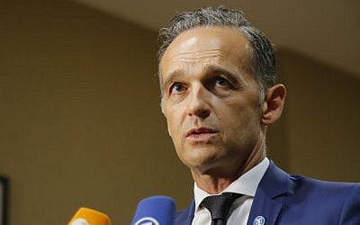 German Foreign Minister Heiko Maas speaks to the media after a meeting on the divisive migrant issue in Paris, France, July 22, 2019. (AP Photo/Michel Euler)