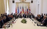 The European Union's political director Helga-Maria Schmid and Iran's deputy Foreign Minister Abbas Araghchi, center from left, wait for a bilateral meeting as part of the closed-door nuclear talks with Iran at a hotel in Vienna, Austria, July 28, 2019. (AP)