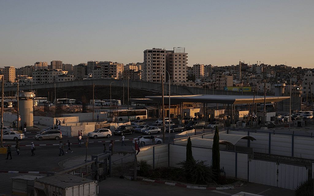 Cars pass the Qalandiya crossing between the West Bank city of Ramallah and Jerusalem, July 11, 2019. (Sebastian Scheiner/AP)