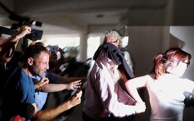 A police officer escorts a 19-year-old British woman, center, to Famagusta court in town of Paralimni, Cyprus, July 29, 2019. (AP Photo/Petros Karadjias) A police officer escorts a 19-year-old British woman, center, to Famagusta court in town of Paralimni, Cyprus, July 29, 2019. (AP Photo/Petros Karadjias)