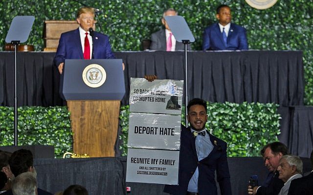 Virginia Del. Ibraheem Samirah, D-Fairfax, yells as he interrupts US President Donald Trump's addresses Tuesday, July 30, 2019. (AP Photo/Steve Helber) Virginia Del. Ibraheem Samirah, D-Fairfax, yells as he interrupts US President Donald Trump's addresses Tuesday, July 30, 2019. (AP Photo/Steve Helber)
