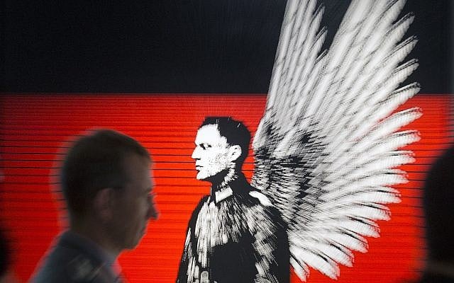 In this zoomed picture an officer of the German Federal Armed Forces, Bundeswehr, stands in front of the serigraphy 'Hero portrait. Claus Schenk Graf von Stauffenberg' (2004) by German artist Petrus Wandrey during the press preview of the new special exhibition 'Attentat auf Hitler. Stauffenberg und mehr' (Assassination attempt against Hitler. Stauffenberg and more) in the Military History Museum in Dresden, Germany, Wednesday, July 2, 2014. (AP Photo/Jens Meyer) In this zoomed picture an officer of the German Federal Armed Forces, Bundeswehr, stands in front of the serigraphy 'Hero portrait. Claus Schenk Graf von Stauffenberg' (2004) by German artist Petrus Wandrey during the press preview of the new special exhibition 'Attentat auf Hitler. Stauffenberg und mehr' (Assassination attempt against Hitler. Stauffenberg and more) in the Military History Museum in Dresden, Germany, Wednesday, July 2, 2014. (AP Photo/Jens Meyer)