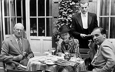 British author P.G. Wodehouse, left, is reunited with his wife Ethel after being released from internment in Berlin, August 13, 1941. The couple are chatting with a Foreign Office representative on the terrace of a German hotel, according to the Nazi censor-approved caption. (AP Photo)
