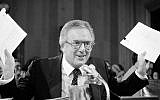 Former Florida Senator Richard Stone holds up lists of the names of Latin American officials during his nomination hearing to become Ambassador at Large for Central America before the Senate Foreign Relations Committee, May 20, 1983 on Capitol Hill. (AP Photo/Ira Schwarz)