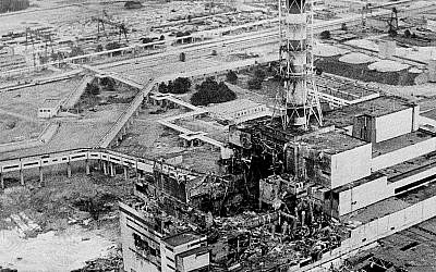An aerial view of the Chernobyl nuclear power plant, the site of the world's worst nuclear accident, is seen two to three days after the April 26, 1986, explosion. In front of the chimney is the destroyed 4th reactor. (AP Photo)