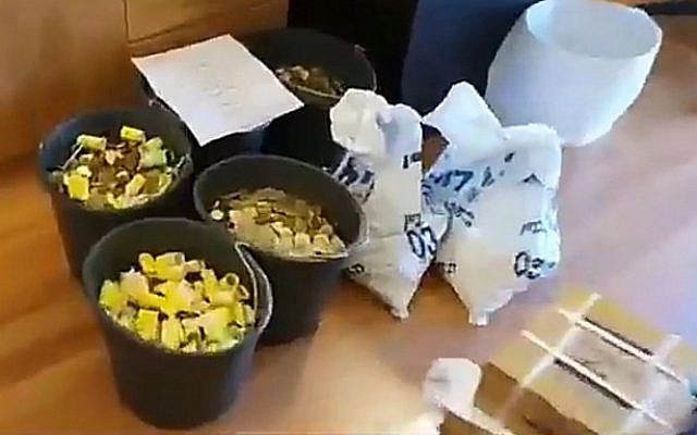 Screen capture from video of some 300,000 coins an ultra-Orthodox radio state used to pay a court-ordered fine to a feminist group, July 16, 2019. (Twitter) Screen capture from video of some 300,000 coins an ultra-Orthodox radio state used to pay a court-ordered fine to a feminist group, July 16, 2019. (Twitter)