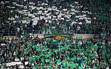 Illustrative: Fans of the Maccabi Haifa soccer team cheer during a game at the Teddy stadium in Jerusalem, May 24, 2016. (Yonatan Sindel/Flash90)