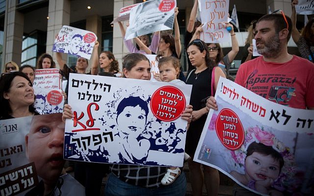 Israelis demonstrate against the lack of supervision in daycares outside the Tel Aviv Government complex on June 21 2018. (Miriam Alster/Flash90) Israelis demonstrate against the lack of supervision in daycares outside the Tel Aviv Government complex on June 21 2018. (Miriam Alster/Flash90)