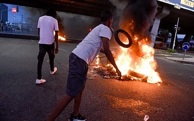 Ethiopian Israelis protest following the shooting death of 19-year-old Ethiopian, Solomon Tekah, in Kiryat Haim by an off-duty police officer, outside Kiryat Ata, July 1, 2019. (Meir Vaknin/Flash90)