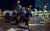 Israeli police officers at a protest following the death of 19-year-old Solomon Tekah, an Ethiopian-Israeli who was shot and killed a few days before in Kiryat Haim by an off-duty police officer, in Tel Aviv, July 2, 2019. (Adam Shuldman/Flash90)