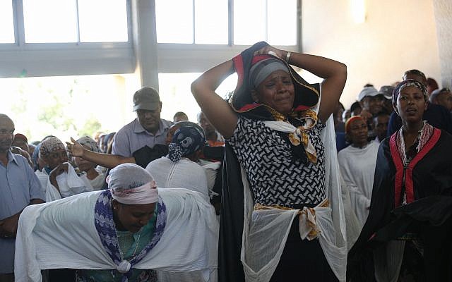 Family and friends at the funeral of Solomon Tekah, in Kiryat Haim, on July 2, 2019 (Yonatan Sindel/Flash90) Family and friends at the funeral of Solomon Tekah, in Kiryat Haim, on July 2, 2019 (Yonatan Sindel/Flash90)