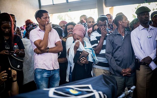 Family and friends mourn at the funeral of Solomon Tekah, in Kiryat Haim, on July 2, 2019 (Yonatan Sindel/Flash90) Family and friends mourn at the funeral of Solomon Tekah, in Kiryat Haim, on July 2, 2019 (Yonatan Sindel/Flash90)