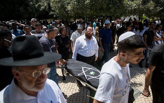 Family and friends mourn at the funeral of Solomon Tekah, in Kiryat Haim, on July 2, 2019 (Yonatan Sindel/Flash90) Family and friends mourn at the funeral of Solomon Tekah, in Kiryat Haim, on July 2, 2019 (Yonatan Sindel/Flash90)