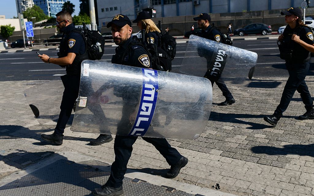 Israeli police officers at a protest following the shooting death of 19-year-old Ethiopian-Israeli Solomon Tekah, in Tel Aviv, July 3, 2019. (Tomer Neuberg/Flash90)