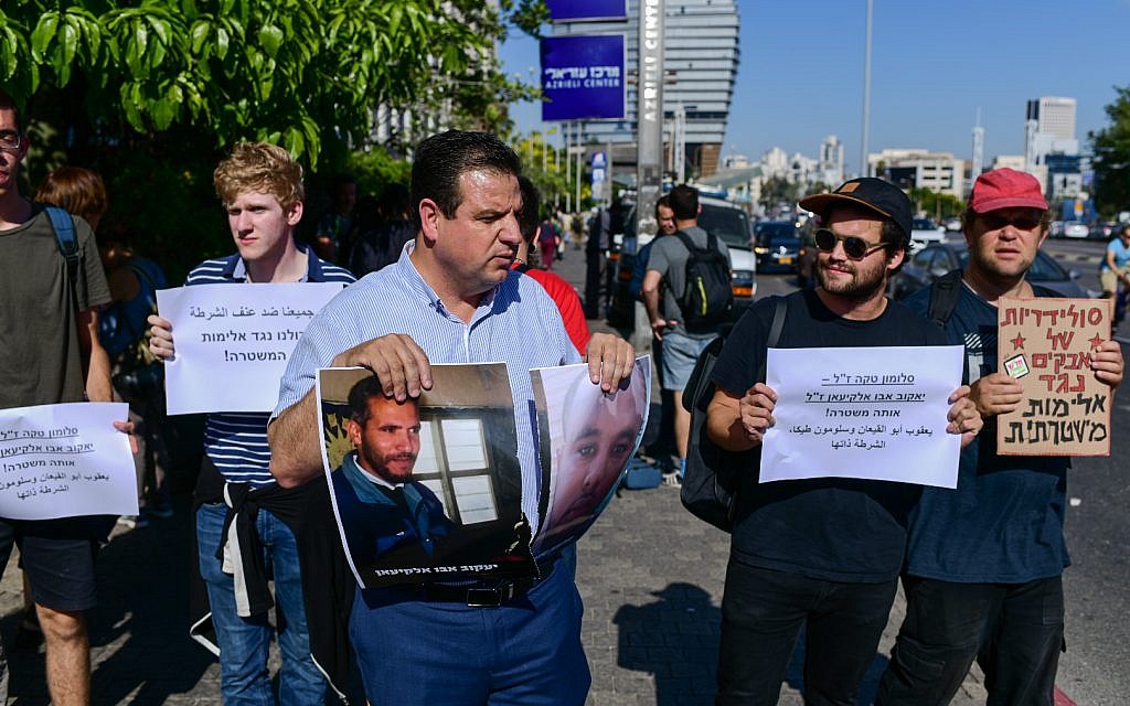 Hadash party MK Ayman Odeh joins an Ethiopian-Israeli protest against police violence in Tel Aviv, July 3, 2019. (Tomer Neuberg/Flash90)