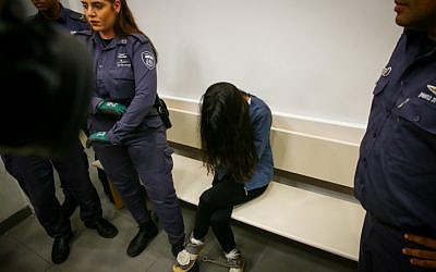 Carmel Mauda, the owner of a kindergarten who was filmed abusing toddlers, sits at the courtroom in Lod, as she arrives for a court hearing on July 7, 2019. (Flash90)