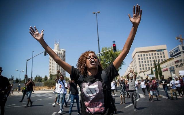 Ethiopian-Israelis and supporters demonstrate against police violence and discrimination following the death of 19-year-old Solomon Tekah, who was shot and killed in Haifa by an off-duty police officer; Jerusalem, July 15, 2019. (Yonatan Sindel/Flash90) Ethiopian-Israelis and supporters demonstrate against police violence and discrimination following the death of 19-year-old Solomon Tekah, who was shot and killed in Haifa by an off-duty police officer; Jerusalem, July 15, 2019. (Yonatan Sindel/Flash90)