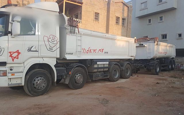 A truck in Kafr Qassem vandalized in an apparent hate crime attack on July 28, 2019. (Israel Police) A truck in Kafr Qassem vandalized in an apparent hate crime attack on July 28, 2019. (Israel Police)