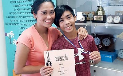 Ofrecina (Precy) Koanka and her learning disabled son Michael James, known as MJ, aged 12. (Screenshot)