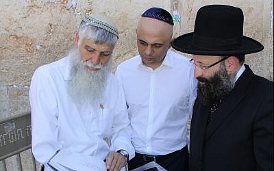 Britain's Home Secretary Sajid Javid, center, visits the Western Wall in Jerusalem, July 1, 2019. (Courtesy The Western Wall Heritage Foundations)