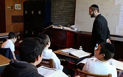 A classroom at Yeshiva Toras Chaim in Norfolk, Virginia. One of the school's teachers, Rabbi Reuven Bauman, went missing on July 9, 2019, when he jumped in the ocean to help a struggling student return to shore. (YouTube screenshot)
