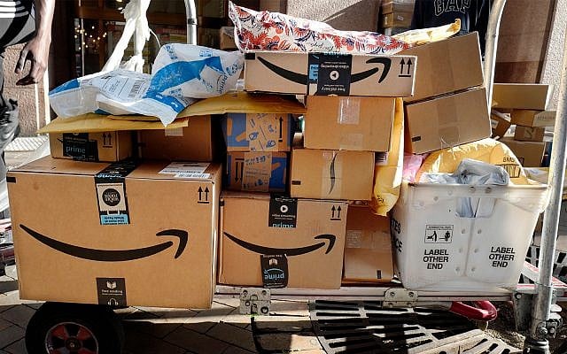Illustrative: Amazon Prime boxes are loaded on a cart for delivery, October 10, 2018, in New York. (AP Photo/Mark Lennihan) Illustrative: Amazon Prime boxes are loaded on a cart for delivery, October 10, 2018, in New York. (AP Photo/Mark Lennihan)