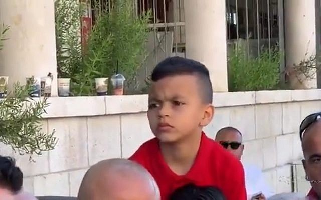 Four-year old Issawiyeh resident Muhammad Rabi Elayyan, who Palestinians say was summoned by Israeli police on suspicion that he threw rocks at officers (Twitter screenshot) Four-year old Issawiyeh resident Muhammad Rabi Elayyan, who Palestinians say was summoned by Israeli police on suspicion that he threw rocks at officers (Twitter screenshot)