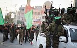 Members of the Izz-a-Din al-Qassam Brigades, the military wing of the Islamist terror group Hamas, take part in a march in Gaza City, July 25, 2019. (Hassan Jedi/Flash90)