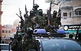 Members of the Izz-a-din al-Qassam Brigades, the military wing of the Islamist terror group Hamas, take part in a march in Gaza City, July 25, 2019. (Hassan Jedi/Flash90)