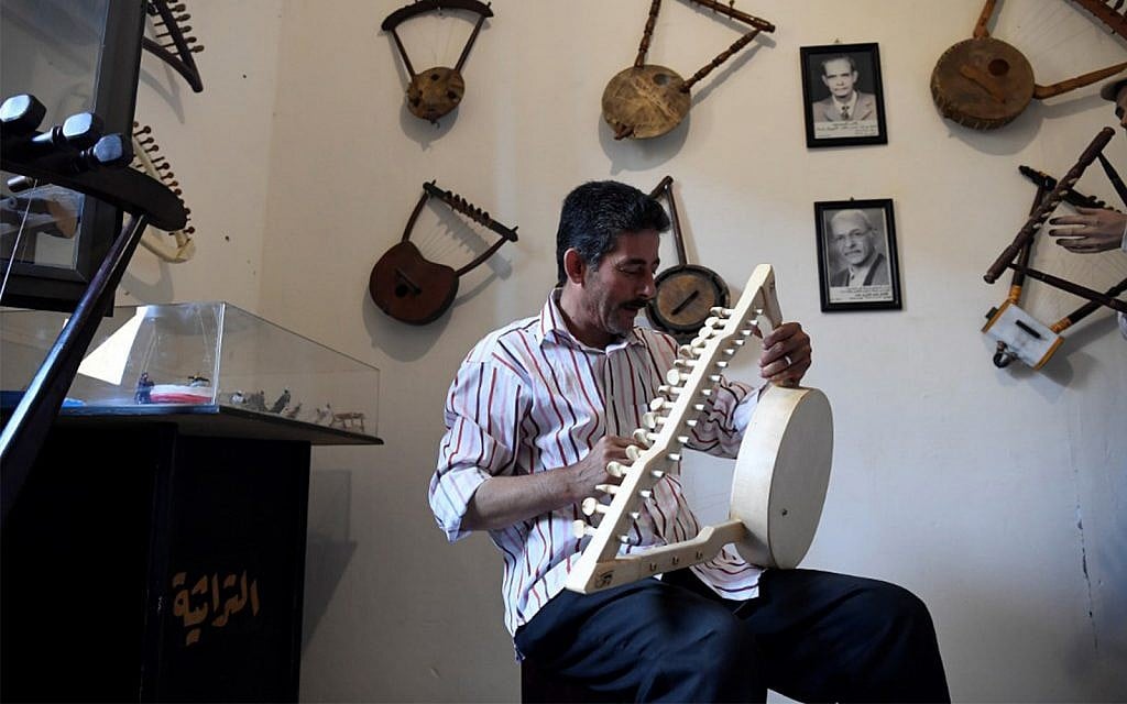 Egyptian craftsman Mohamed Ghaly adds the finishing touches on a semsemia that he made at the Canal 20 cultural museum in the northeastern city of Port Said at the northern terminus of the Suez Canal, on May 29, 2019. (Khaled Desouki/AFP) Egyptian craftsman Mohamed Ghaly adds the finishing touches on a semsemia that he made at the Canal 20 cultural museum in the northeastern city of Port Said at the northern terminus of the Suez Canal, on May 29, 2019. (Khaled Desouki/AFP)