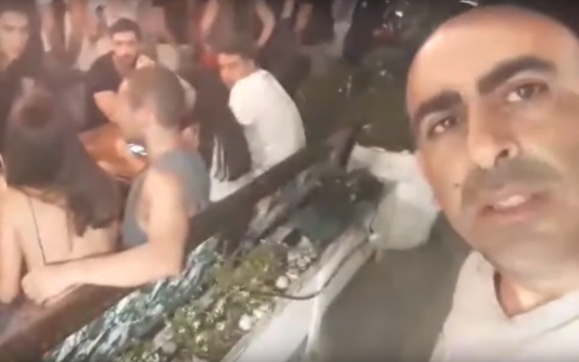 Self-described activist Barak Cohen (R) filming himself harassing Avner Netanyahu, July 27, 2019. (Screenshot: Twitter) Self-described activist Barak Cohen (R) filming himself harassing Avner Netanyahu, July 27, 2019. (Screenshot: Twitter)