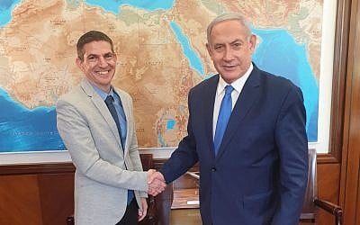 Evan Cohen, left, with Prime Minister Benjamin Netanyahu (GPO)