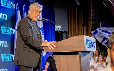 Blue and White No. 2 Yair Lapid addressing party activists in the coastal town of Shefayim, July 14, 2019. (Jane Peimer)