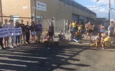 Illustrative: Hundreds of people organized by a Jewish group called Never Again Action  protest outside of an Immigration and Customs Enforcement (ICE) facility in Elizabeth, New Jersey, June 30, 2019. (Screenshot from Facebook via JTA)