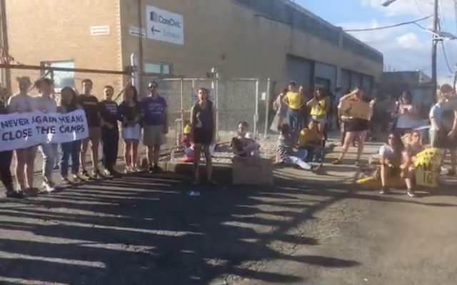 Illustrative: Hundreds of people organized by a Jewish group called Never Again Action protest outside of an Immigration and Customs Enforcement (ICE) facility in Elizabeth, New Jersey, June 30, 2019. (Screenshot from Facebook via JTA) Illustrative: Hundreds of people organized by a Jewish group called Never Again Action protest outside of an Immigration and Customs Enforcement (ICE) facility in Elizabeth, New Jersey, June 30, 2019. (Screenshot from Facebook via JTA)