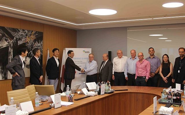 Officials from Harel Insurance Investments & Financial Services Ltd. and Japanese insurance corporation Tokio Marine Holdings Inc. sign accord to join forces in scouting for cutting edge Israeli tech; Ramat Gan, July 24, 2019 (Batia Mor) Officials from Harel Insurance Investments & Financial Services Ltd. and Japanese insurance corporation Tokio Marine Holdings Inc. sign accord to join forces in scouting for cutting edge Israeli tech; Ramat Gan, July 24, 2019 (Batia Mor)