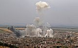 This file photo taken on May 23, 2019 shows smoke rising following reported Syrian government bombardment on the town of Khan Sheikhoun in the southern countryside of the rebel-held Idlib province. (Anas Al-Dyab/AFP)