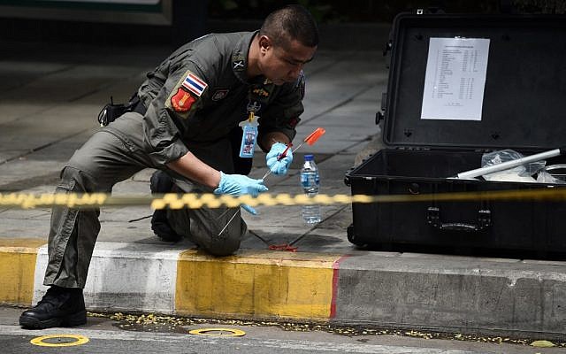 A policeman conducts an investigation at the scene of an explosion in Bangkok on August 2, 2019. (Lillian SUWANRUMPHA / AFP) A policeman conducts an investigation at the scene of an explosion in Bangkok on August 2, 2019. (Lillian SUWANRUMPHA / AFP)