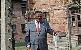 US civil rights activist Jesse Jackson touches a barbed wire fence at the former Nazi death camp Auschwitz-Birkenau to commemorate 75 years since the killings of the Sinti and Roma at the camp in Oswiecim, on August 2, 2019. (Alik Keplicz/AFP)