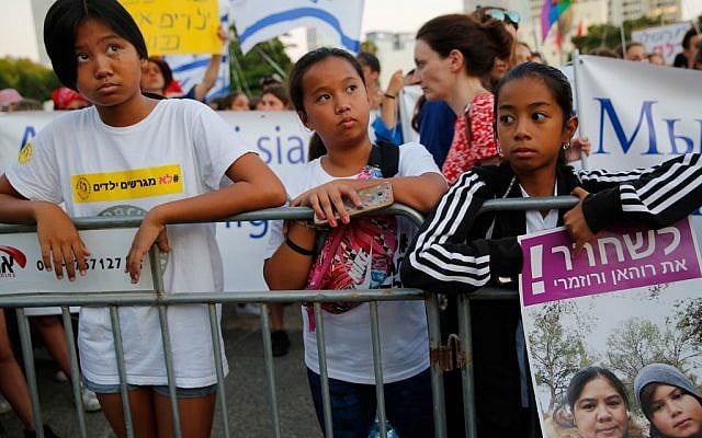 Filipino children carry banners during a protest against deportation in Tel Aviv on August 6, 2019. (Gil COHEN-MAGEN / AFP) Filipino children carry banners during a protest against deportation in Tel Aviv on August 6, 2019. (Gil COHEN-MAGEN / AFP)