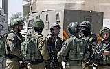 Israeli soldiers stand guard during a house-to-house search operation in the West Bank village of Beit Fajjar near Bethlehem on August 8, 2019, following a stabbing attack that killed Dvir Sorek, 19. (HAZEM BADER / AFP)