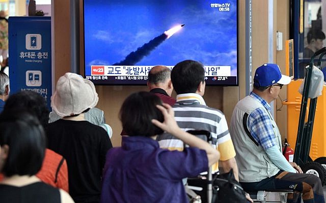 People watch a television news screen showing file footage of North Korea's missile launch, at a railway station in Seoul on August 10, 2019. (Jung Yeon-je / AFP) People watch a television news screen showing file footage of North Korea's missile launch, at a railway station in Seoul on August 10, 2019. (Jung Yeon-je / AFP)