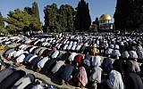 Muslim worshipers perform the Eid al-Adha morning prayers at the Temple Mount in the Old City of Jerusalem on August 11, 2019. (Ahmad Gharabli/AFP)