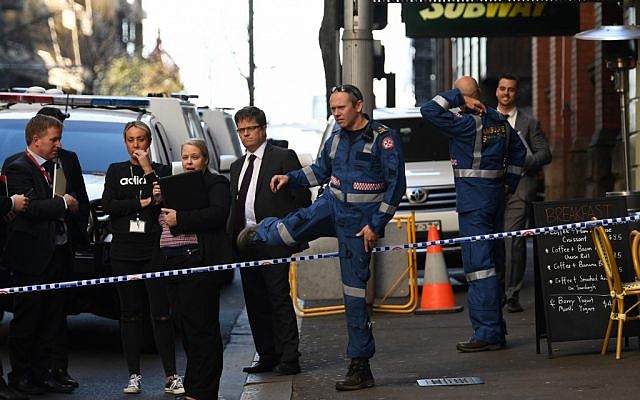Police gather at the crime scene after a man stabbed a woman and attempted to stab others in central Sydney on August 13, 2019, before being pinned down by members of the public and detained by police. (Photo by Saeed KHAN / AFP) Police gather at the crime scene after a man stabbed a woman and attempted to stab others in central Sydney on August 13, 2019, before being pinned down by members of the public and detained by police. (Photo by Saeed KHAN / AFP)
