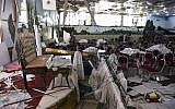 Afghan men investigate in a wedding hall after a deadly bomb blast in Kabul on August 18, 2019. (Wakil Kohsar/AFP)