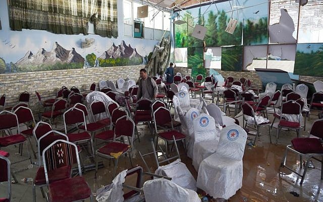 Afghan men investigate in a wedding hall after a deadly bomb blast in Kabul on August 18, 2019. (Wakil Kohsar/AFP) Afghan men investigate in a wedding hall after a deadly bomb blast in Kabul on August 18, 2019. (Wakil Kohsar/AFP)
